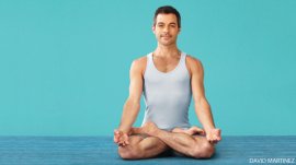 man doing yoga in padmasana lotus pose